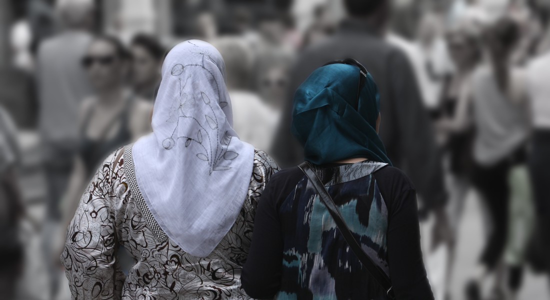 Two women with scarps from behind 